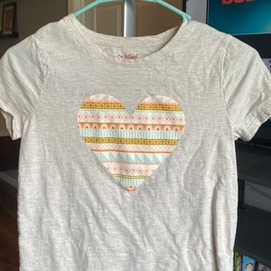White/grey shirt with colorful heart in middle